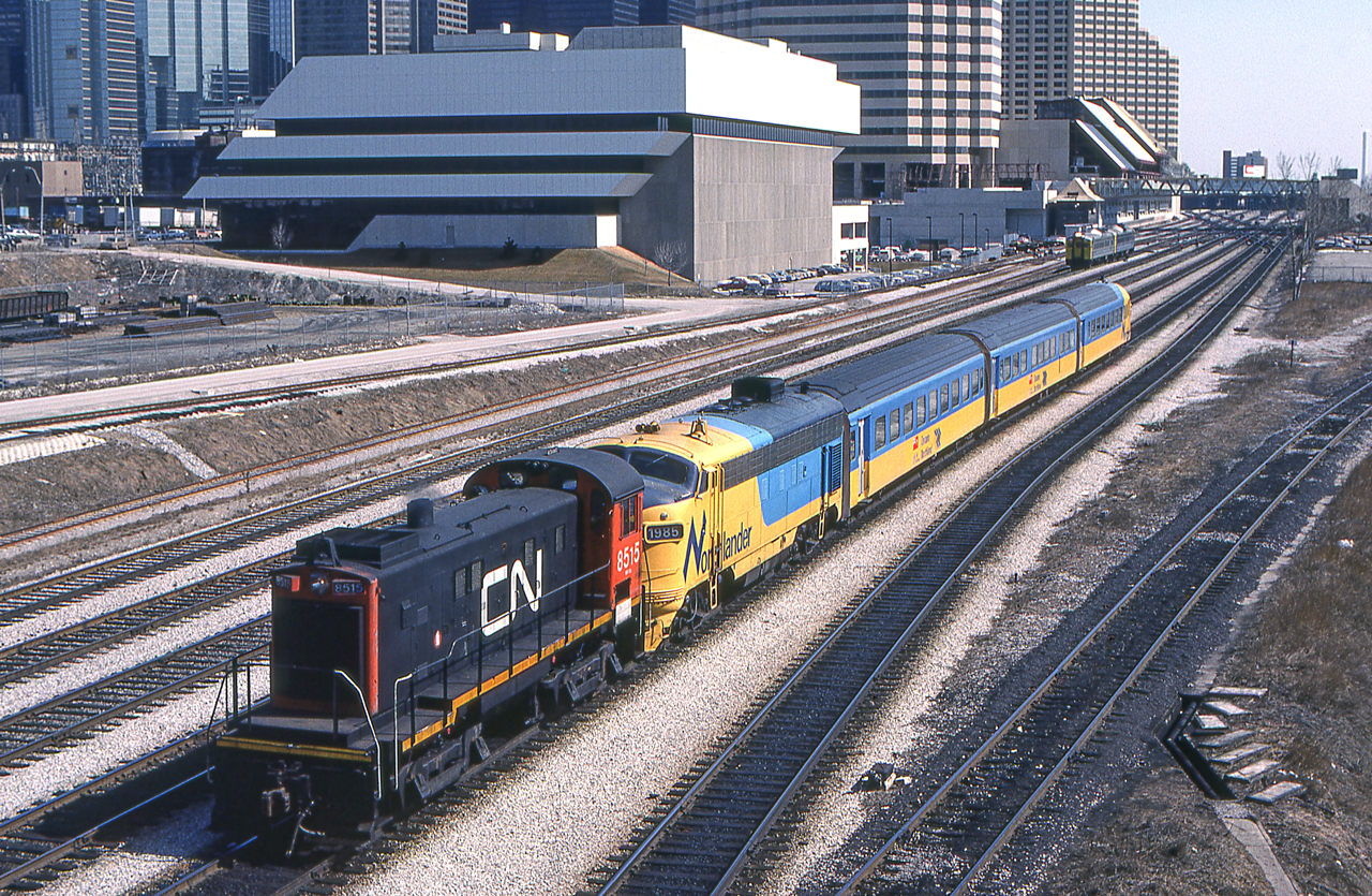 It is Toronto on March 28, 1984 where CN 8515 is moving an Ontario Northern "Northlander" headed by Ontario Northern 1985. VIA 6109 is in the background.