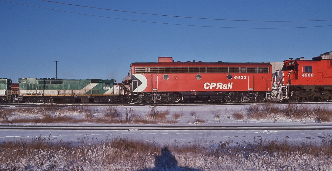 Saturday / Sunday Mornings required a statutory trip through Agincourt.


And always something worth capturing.


Christmas colours too!


GMD 1966 built GP40TC, GO #504 was a GO original, to Amtrak 1988 & had a longer career there than with GO, coupled to a 700 series sister. 


GMD 1951 built F7B, CP Rail #4433 and sisters were retired by 1983


MLW 1970 built M-630, CP Rail #4560 was delivered as #4515 and renumbered in 1971. All M-630 models retired by 1995.


and a TH&B geep hiding behind the GO sisters...and my shadow in the foreground.


At CP Rail Agincourt, December 22, 1979 Kodachrome by S.Danko


more Agincourt


   contrasting livery