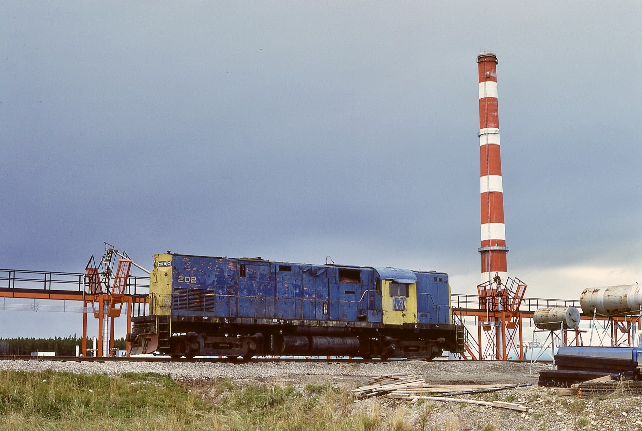 Fifteen miles southwest of the town of Rocky Mountain House in the foothills of Alberta, and 20.5 rail miles from there via CN’s Brazeau and Ram River subdivisions and the Strachan spur, Gulf Oil’s gas scrubbing plant had PV Commodity Systems as a contractor handling sulphur loadout to rail cars.  For a locomotive, PVCS had an ALCo C-420 number 202 (serial 84724 built 1963-12, nee Long Island 202) for switching sulphur empties and loads, and it was seen at rest on 1978-09-15.

That gas plant is now operated by Keyera, and I have no knowledge of their railway activity today.  PVCS 202 went to Western Canada Steel in Calgary in 1985-06.