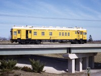 I have to admit I do miss those colourful Sperry cars that used to roam the rail system. I don't know how long it has been since the cars were replaced by rather unappealing trucks, but it has got to be 25 years. What a difference.  With the cars there was room to roam around; with the truck you are pretty much stuck in the seat. Usually when I see one of the Sperry Rail Service trucks these days it is parked alongside the line at a crossing waiting for rail traffic to clear. Must make for a long day for those fellers.
This image was taken in early March of 1978 showing the SRS car #139 crossing over Fourth St Louth in West St. Catharines.