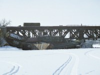 Along with the view taken from the road bridge over the railroad at the Grand River in Cayuga, I'm offering this shot of the mess that piled up when this probably westbound train derailed a few cars into the frozen river. I have no idea why my film developed so poorly from this adventure. Just one of those happenings. But at least one can see the extent of the damage.  I did see a couple of other photographers up near the wreck, but I stayed back.