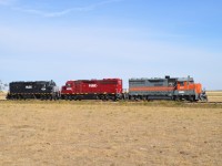 One would assume business is picking up on the fledgling Forty Mile Rail Line, which runs from a connection with CP at Stirling to the community of Foremost, Alberta, which is actually 50 miles.  The HLCX 4224 is listed in the Trackside Guide as being on their roster. The other two are not. I did see FURX 4222 on the property a couple of years ago, and now they have added, at least for now 6327, which the reporting marks indicate it was assigned to the Lake Line Railroad of Manitoba.  Wide open plain, good sun and colourful locomotives makes for a nice photo.