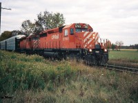 During an October afternoon, a CP westbound with SD40-2 5793 and SD40 5513 is paused at the Trussler Road crossing, just west of Ayr, for a meet with an eastbound from London, Ontario on the Galt Subdivision at Wolverton. 