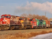 CPKC train 419 is building at Lambton Park.  Being towed dead behind the road power are ex Shell Scotford plant switching units. EMD SW900 JLCX 136 and EMD GP20 mother slug set CRLX 2000 and 2001. (Future destination unknown)