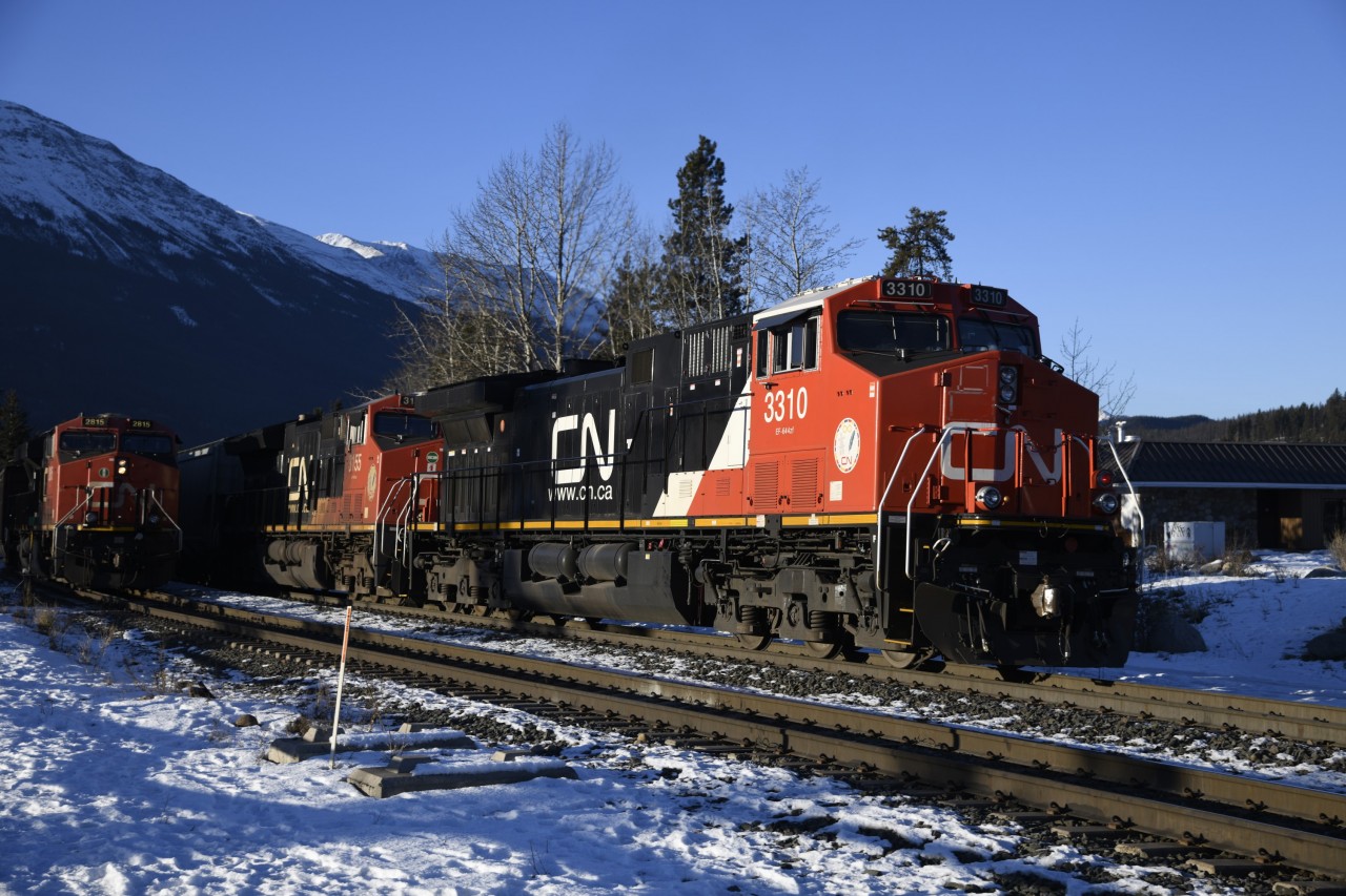 One out, one in  
CN 3310 and CN 3155 are on the tail end of a westbound freight leaving Jasper, AB on a bitterly cold but sunny late November 2023 morning. 
As soon as the westbound clears, CN 2815 will notch it up and begin its move across the Hazel Avenue crossing at Mile 0.29 on CN's Albreda Sub. and into the yard. 
There was no shortage of east and westbound train movements in and out of the yard at Jasper during my three days in town. :-)