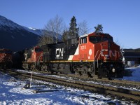 <b> One out, one in </b> <br>
CN 3310 and CN 3155 are on the tail end of a westbound freight leaving Jasper, AB on a bitterly cold but sunny late November 2023 morning. <br>
As soon as the westbound clears, CN 2815 will notch it up and begin its move across the Hazel Avenue crossing at Mile 0.29 on CN's Albreda Sub. and into the yard. <br>
There was no shortage of east and westbound train movements in and out of the yard at Jasper during my three days in town. :-)