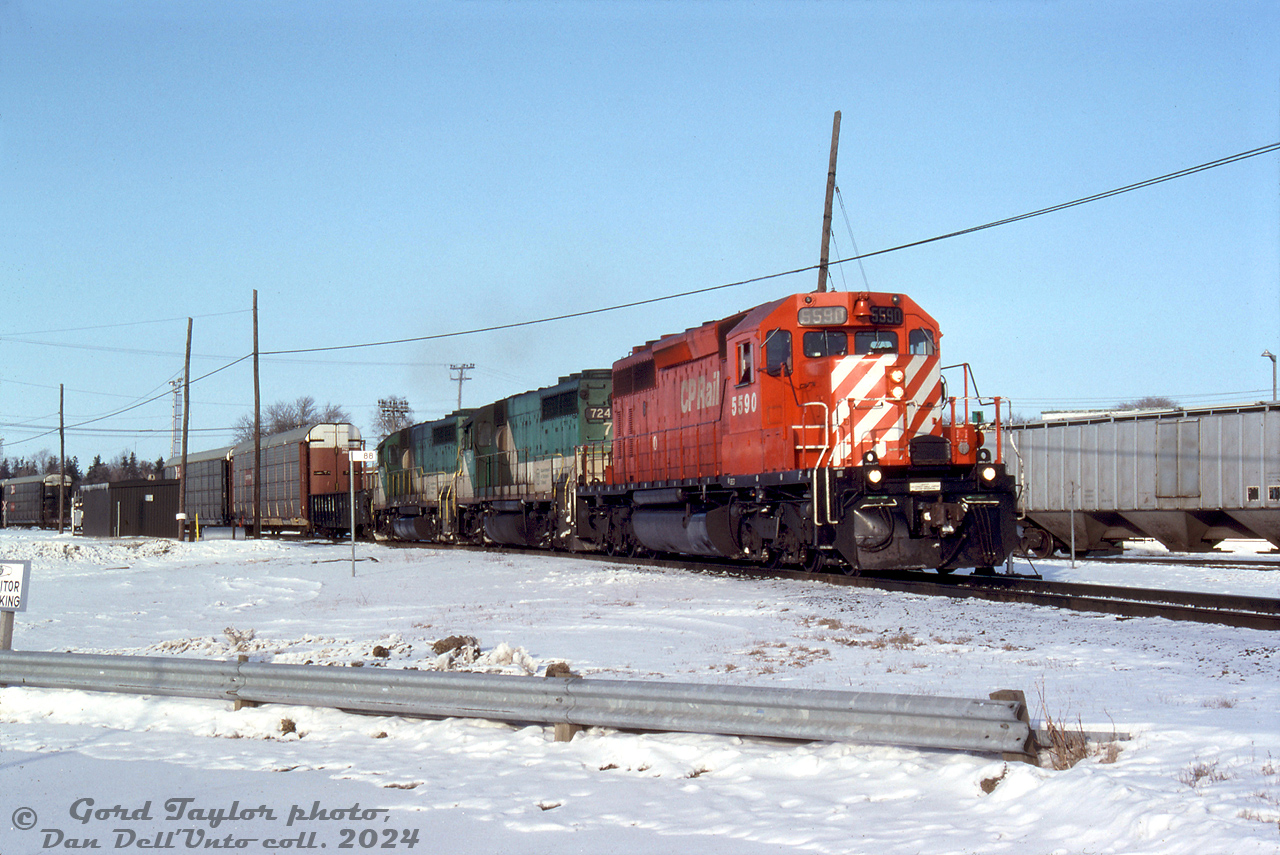 Back when new GO F59PH's had taken over a lot of GO's commuter trains and rendered their older power surplus, some of the ex-Rock Island GP40-3's found their way leased to CP for freight service. At Woodstock in early February 1992, CP SD40-2 5590 leads GO GP40-3's 724 and 723 on a westbound freight near the west end of the yard, just past Ingersoll Avenue. Both would be traded in to EMD two years later on a new F59PH order, and join the EMD lease fleet in the EMDX 200-series.

Gord Taylor photo, Dan Dell'Unto collection slide.