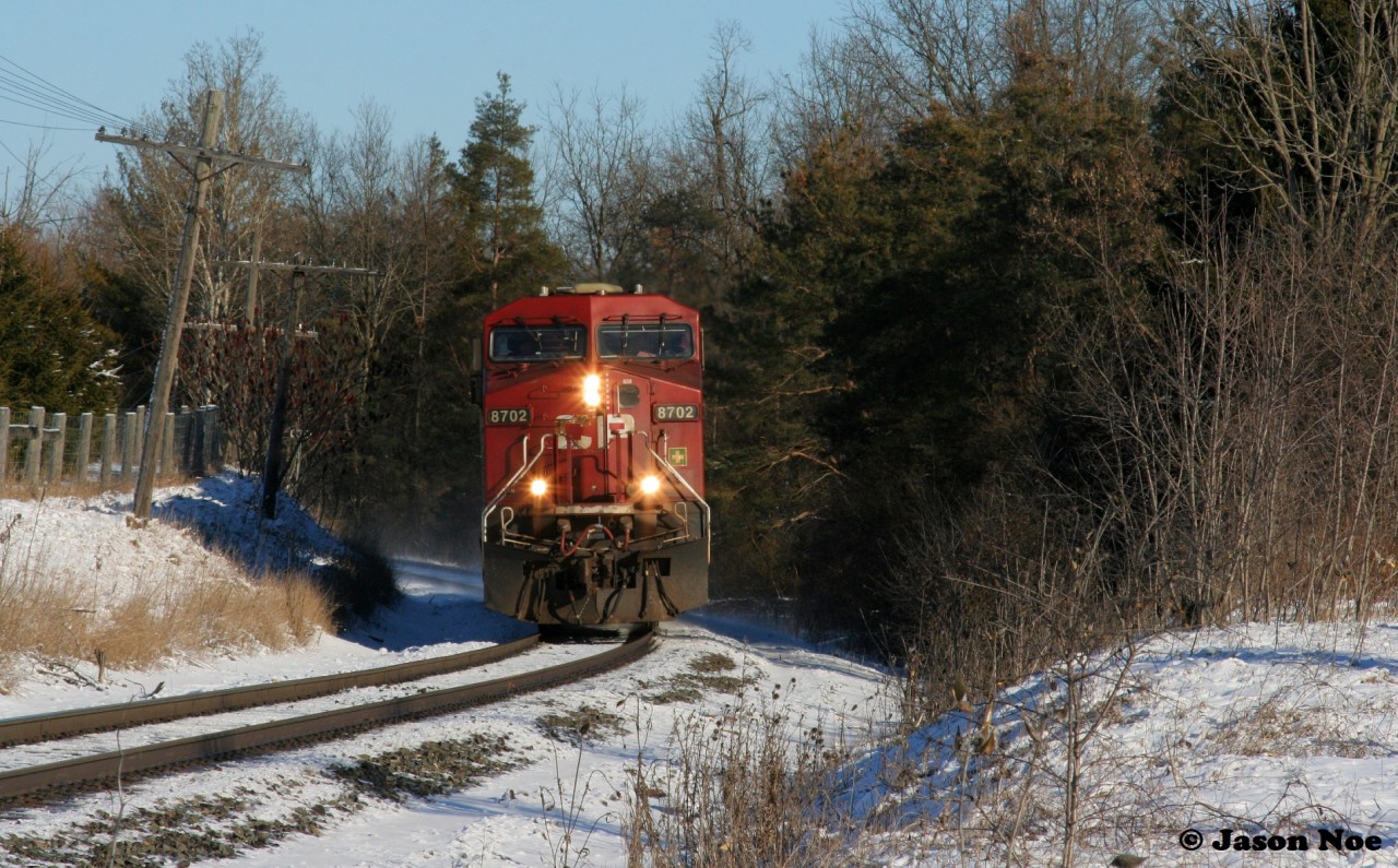 CP 137 is only light power seen having just crossed the Nith River bridge in Ayr, Ontario  as it approaches Wolverton on the Galt Subdivision.