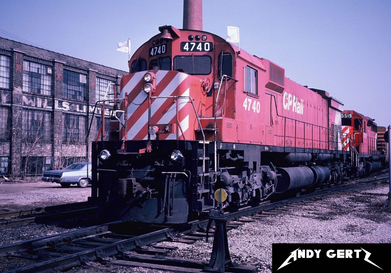 A CP westbound train with M636 4740 and SD40 5519 prepare to depart the west-end of CP's Quebec Street Yard in London. The building in the background was torn down in later years.
