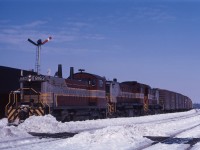 Three "branch line units" (8163, 8019, and 8044) lead an Extra West through Guelph Jct late in the winter of 1965. While Spring is supposed to be "just around the corner", there's still lots of snow on the ground on this bright day. 