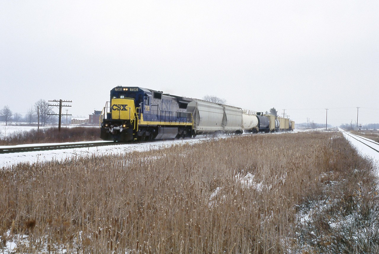 One of CSX's last trains on the CASO makes its way west through Canfield. Not that many years ago, you could see many NYC and C&O trains here, as well as Wabash "Red Balls" on the adjacent CN line. Now CSX is down to short trains three days a week in each direction and Norfolk Southern has been running through Hamilton since the middle of last year. Things will get even quieter when the last CSX train runs on February 29th.