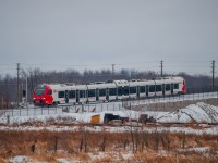 On January 26, 2024, O-Train train C11 departs from Limebank Station to Greenboro.
