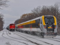 On January 8, 2023, VIA 35 passes CN 519 (Saint-Hyacinthe switcher) working west of the yard.