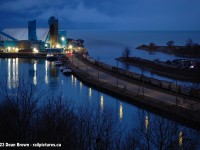 On a cold winter evening at Goderich, ON viewing the Compass Minerals’ Goderich salt mine as 40ft Covered hoppers waiting to be loaded with salt to be shipped out by GEXR. 