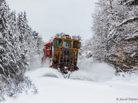 CN W908 works northbound on along the Newmarket Sub with spreader 50948 between Washago and Huntsville.  Upon arriving at Huntsville, the spreader would be left in the yard, while 8822 was added to the cut of cars waiting for A450 to lift a short while later.
