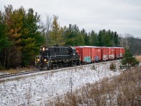 Amid a dusting of snow, GIO Rail 1859 makes its way to St. Catharines with three loads for Clearwater Paper.  They will return straight back to Feeder with three empties; two from the plant and one of the loads seen here.  As only two cars can be spotted at once, the crew waited about an hour for the first car to be unloaded before spotting the other two.