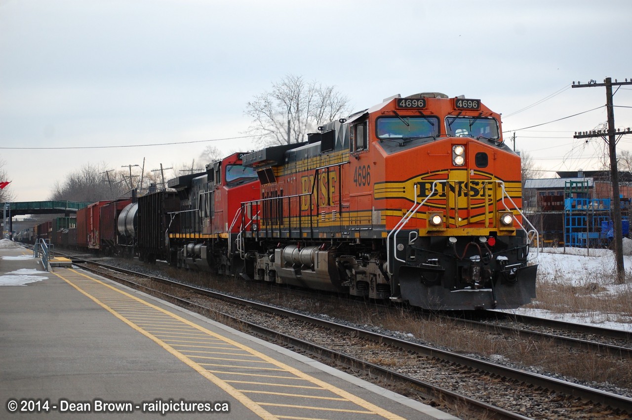 CN 331 with BNSF C44-9W 4696 and CN C44-9W 2578 through St. Catharines on a cold day in March.