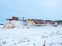 It's been 15 years since I caught my last plow train and when word slipped OSR was running one down the old Port Burwell I found it hard to believe. We had only received maybe 10 cm of snow in the area. Hardly enough in my mind for a plow run to be worth it. Low and behold a drive over to Salford early in the morning revealed OSR crews having readied the plow with their pair of F units. There were sections of the track that had drifted over the railhead and I tried to seek a location that had potential for some good action but at bay from other photographers. My first shot of the day came a few miles south of Salford as the engineer aboard 6508 accelerated plow 401005 into a mildly drifted section of the sub. Goes to show you don't need a lot of snow to come out with a decent action shot of a plow.