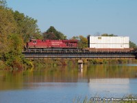 CP 142 with CP ES44AC 8786 crosses the Welland River on a sunny warm late afternoon in Sept of 2014.