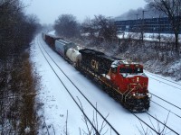 CN 322 is heading towards Southwark Yard on a snowy morning after setting off traffic at Taschereau Yard.