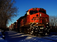 Normally leaving Montreal well before sunrise, a very late CPKC 228 is leaving mid-afternoon, with a BNSF leader.