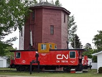 CNR built caboose 78114 along side a water tower at the museum in Harris, Saskatchewan. Built by the CNR in 1934 to plan 150-99, the water tower was designed to hold 40,000 gallons of water.