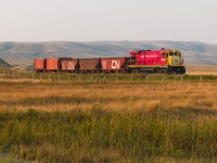 GWRS began ramping up MoW operations in the late summer through early winter of 2023, running regular Ballast trains to facilitate new siding construction across their system. The first generation of siding construction began in August, running 4062 solo between their ballast source in Horizon on the RCRR and the 3 new sidings at Valour, about halfway between Limerick and Assiniboia. This first operation took about 2 weeks to complete, sending 1-2 loads every weekday, with each load of ballast covering about half the siding length at Valour. From what I understand, these MoW operations continued onto other locations until November when a friend of mine went himself to catch grain season. Here they finish easing into the Willow Bunch Valley after starting the downgrade in Verwood as they follow the valley towards Assiniboia.