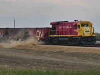 Part 2 of my GWRS Ballast post. Here is their dumping operation at Valour, facilitated by about 2 or 3 foremen trucks worth of ballast crews, which I had essentially followed by accident from the same gas station in Assiniboia. This was actually my first time watching a ballast dumping operation in my life, but I still managed to notice a significant difference between the ballast grades used by Class Is and the type being dumped here: GWRS seems to use a heterogenous mixture of what I believe to be finer sandstones, feldspar-embedded granite, and andesite. Canadian Pacific, on the other hand, accesses a homogenous grade of andesite sourced directly from trackside mines located in Dyment, Ontario on the Canadian Shield or Swansea, BC, in the Rocky Mountains. The relatively small capacity to carry ballast based on GWRS' limited stock of open-top hoppers made the dumping operation finish within an hour of arriving. Then they ran 4062 around and ran southern style back to Horizon to reload from the pit they had compiled there.