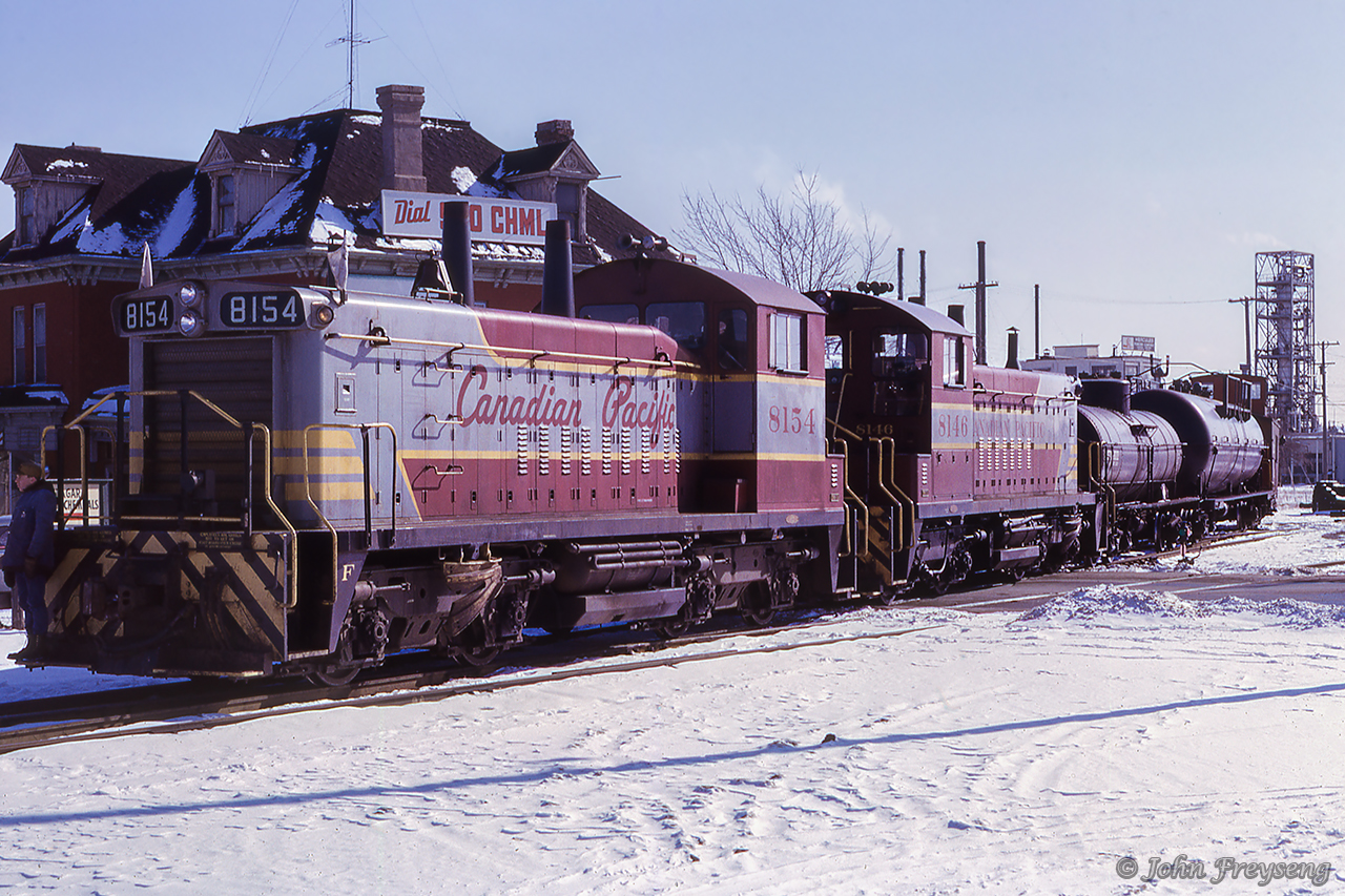 Canadian Pacific's Burlington wayfreight is seen on the Beach Sub just west of Brant Street at Burlington West, ready to depart eastward back to Toronto.   Note the train order signal for Beach Sub movements above the second tank car.Scan and editing by Jacob Patterson.