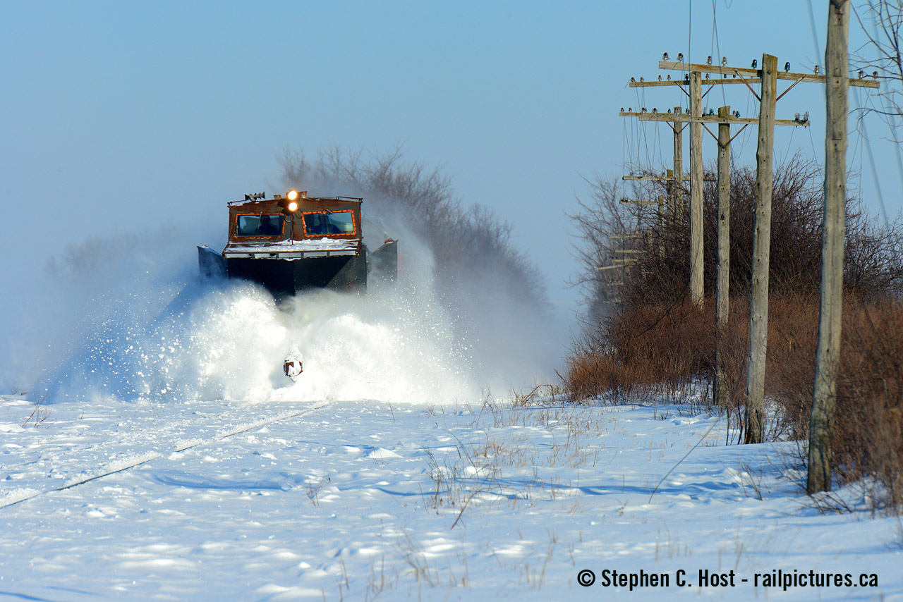 Tis the season.... Dave Young was the fist to post a plowing shot from the past this year - and a great shot it is and now that the snow is finally flying, I thought I'd dig into my archives. It was 10 years ago that I followed OSR's plow for the first time on a beautiful sunny blue sky morning. I couldn't get the plow runs years earlier due to family commitments - but glad folks like Dave Young did! After a few hours following OSR as they ran to St. Thomas with a gaggle of folks including Jim Brown>/a> I headed home for Guelph but decided to head through Stratford, as I heard they ran a plow the night before - expecting to get something parked by the station, I instead found the plow arriving back at Stratford after a run to Goderich - in the exact spot Dave photographed his above. Expecting them to park the train on a track just east of the Station, imagine my surprise when they got a clearance to head west - I wasn't going home anytime soon. After alerting a few friends including the folks who were following OSR earlier that day, it was off to the races to find a spot for a 2nd plow on the same day, and this is what I was able to do. Given they went faster back then (only 25 MPH today) I'm surprised I got anything at all.
My first chase in '07 - before kids!
The pair together again on a plow, for the first and only time under OSR (so far)
There's lots of photos (GEXR)  (OSR)   (CN - ooh)  (CP - Thomson) on this site. Click to search and find something that perhaps you'll affix your gold star to. Hats off to everyone who braved the weather and shared their stuff. You gotta love winter driving to do this kind of stuff or have amazing friends willing to take you along :)