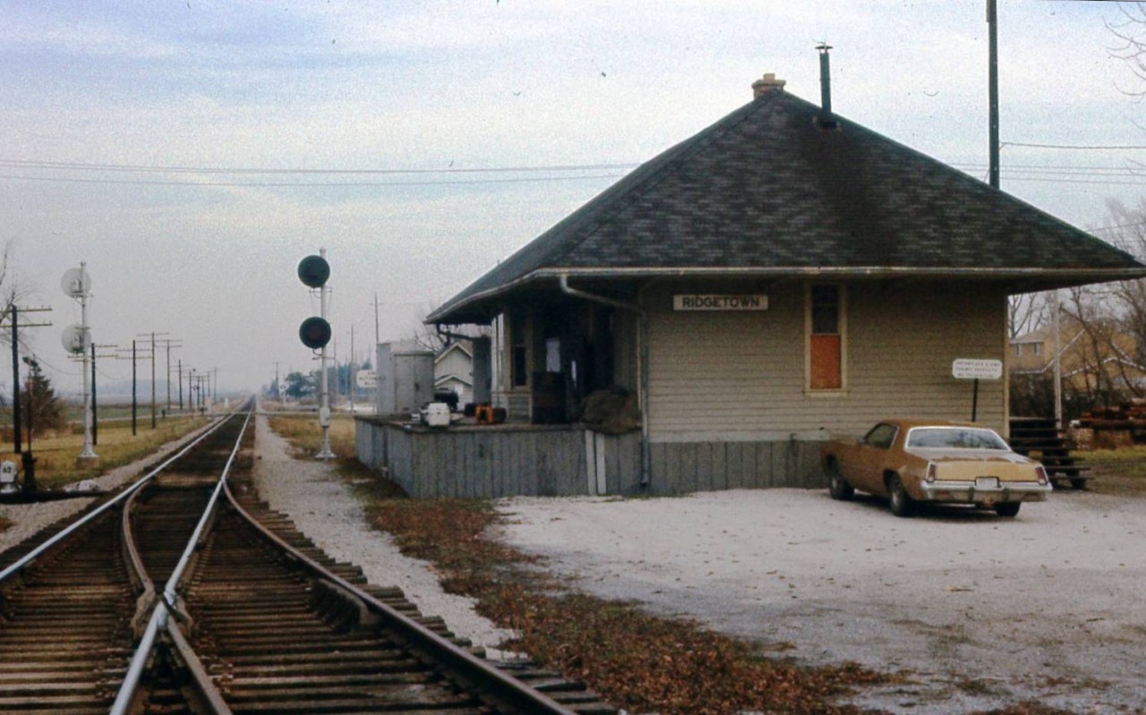 Here's another pic on our way to my fathers home town of Windsor. They were long trips going to Windsor but I do miss the days when he would venture off and take us to these now historic locations. Here looking east and with no trains in the block is the CASO Ridgetown station which is still standing today less the tracks and signals. Taken from my fathers collection