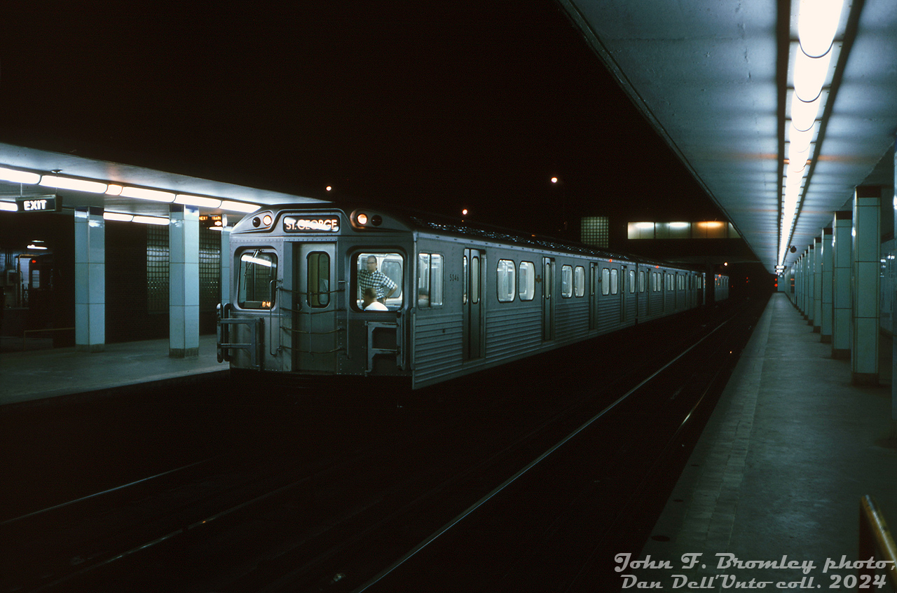 In the wee hours of the night, John Bromley was on the prowl around the deserted platforms of the TTC's Davisville Subway Station and caught a train of brand new Hawker Siddeley H1 subway cars testing on the Yonge line, with H1's 5346, 5347, 5350 and 5351 making up this 4-car consist. The train is sitting at the southbound platforms of Davisville station, with Davisville Shops visible in the background (an old Gloucester subway car is just visible). John probably had his tripod set up for the photo, as the slide mount notes this shot as a 1 second exposure at F4, with a 35mm lens (on Kodachrome, of course).At the time, the 164 new H1 subway cars from Thunder Bay were still being delivered to Greenwood Yard (a report from John in the UCRS newsletter states 46 of the 5336-5499 order was on the property at the time). Crews were undergoing training and testing on them, and 14 cars had been assigned to Davisville Yard including 5346-47 and 5350-51. The first H1 train had entered revenue service on July 26th, and the plan was to have a number of H1 trains based out of Davisville in revenue service on the Yonge line until the new Bloor-Danforth line they were purchased for opened in February of next year (there would be a glut of subway cars in the fleet until then, allowing some G's and M1's to be sent to Greenwood for repairs and other work).The H1 fleet was followed up by successive H-series orders over the years, and remained in service for three decades until retirement and replacement by new Bombardier T1 subway cars in the mid-late 90's.John F. Bromley photo, Dan Dell'Unto collection slide.