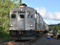 <b> Plain Jane Budd </b> <br>
VIA #186 the Sudbury to White River train has stopped at Mile 88.8 on the CPKC White River Sub. to detrain and entrain passengers going to and coming from the famous Lodge 88 camp which is accessed from this location. <br>
There's lots of activity on the ballast shoulder and right-of-way as camp supplies and customers gear is loaded and unloaded from the baggage section of the leading Budd car. <br>
The nose of VIA 6250 is as plain as it gets! Basic silver/grey paint, no VIA logo, no reflective striping, no stenciled running number.