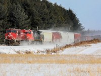 Canadian railroading unity......kicking up the snow.