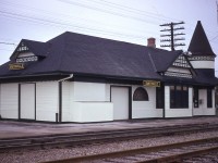  Smithville, situated about one third of the way from Hamilton toward Fort Erie for you out of province viewers, had one of the most beautiful, whimsical stations in Ontario. The structure was built in 1903, replacing an earlier station that burned. This image shows what must be the last gorgeous paint job before the station was abandoned after CP discontinued the Budd car passenger service in the spring of 1981. It sat empty until 1990. West Lincoln County purchased the building and at great expense had the station moved back from the railroad onto a good basement foundation. Later on, the West Lincoln Historical Society bought the station and lot from the Township of West Lincoln, and with the generosity of members and volunteers have kept the building in tip-top condition.