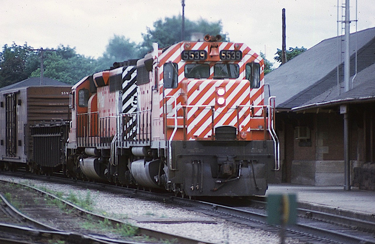 CP SD40 #5539 and sister roar by the old Galt station, extra flags flying, on a somewhat gloomy day back in 1975. I miss seeing the nose paint scheme.