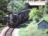  Set of Penn Central units; from front to back in photo, PC 5820, 3819, 3100 and 8100. The location is by King St and the locomotives are backing down into the yard at Chatham St to pick up their train for the Starlite's return to Toronto. Middle pair of units were built as "B" units, without cabs.