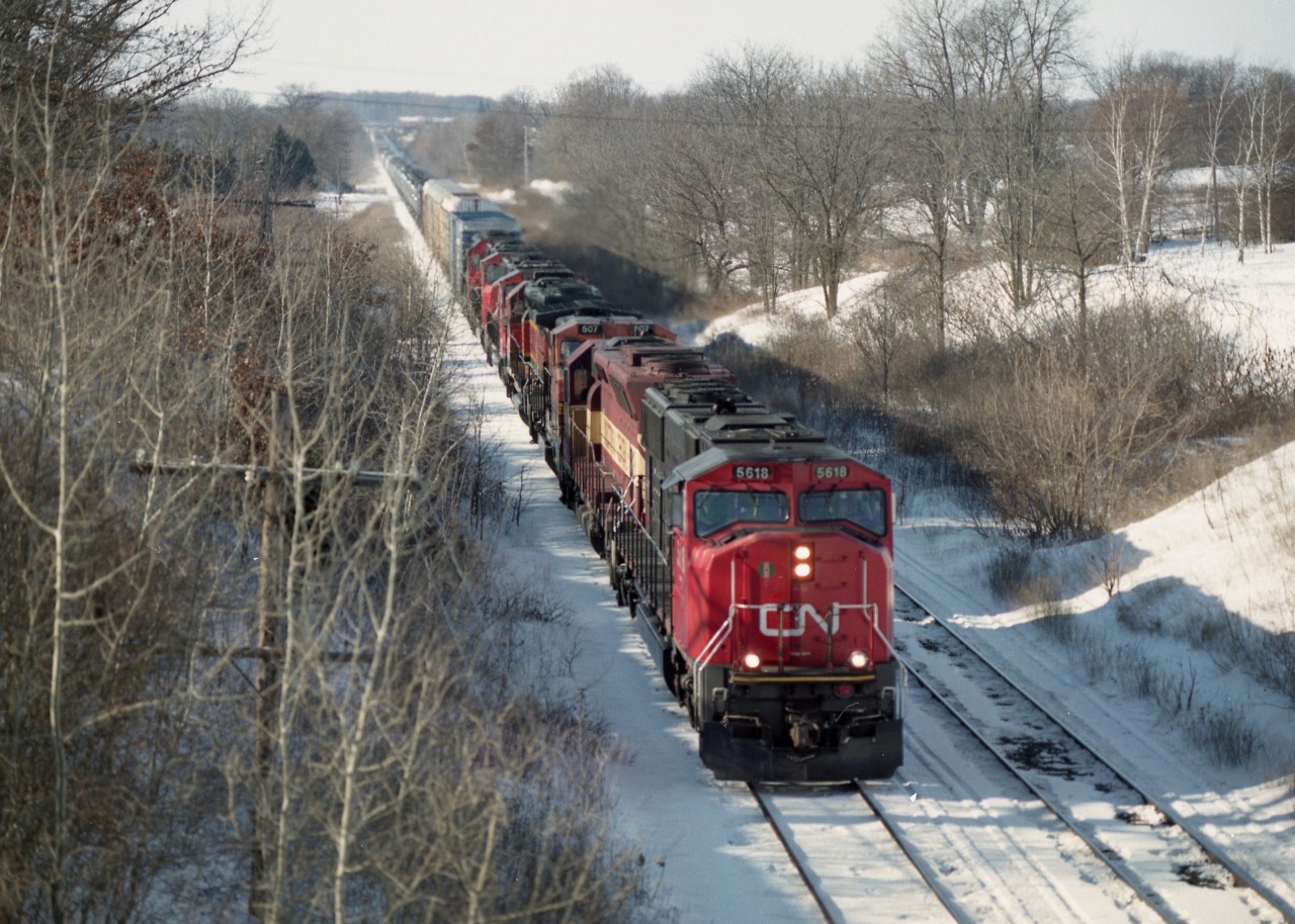 I'm not seeing these days those great lash ups of former years, and I miss them.  I have posted a shot of this train before, but this #394 is worthy of a second offering. This one is of it on approach to Paris West. The power is CN 5618, WC 7518, BNSF 507, 6312, CN 5701, 5603, and 6019.
Beautiful sunny cold day.  Haven't seen many of those kind of days this winter of 2023/24. Strange weather.