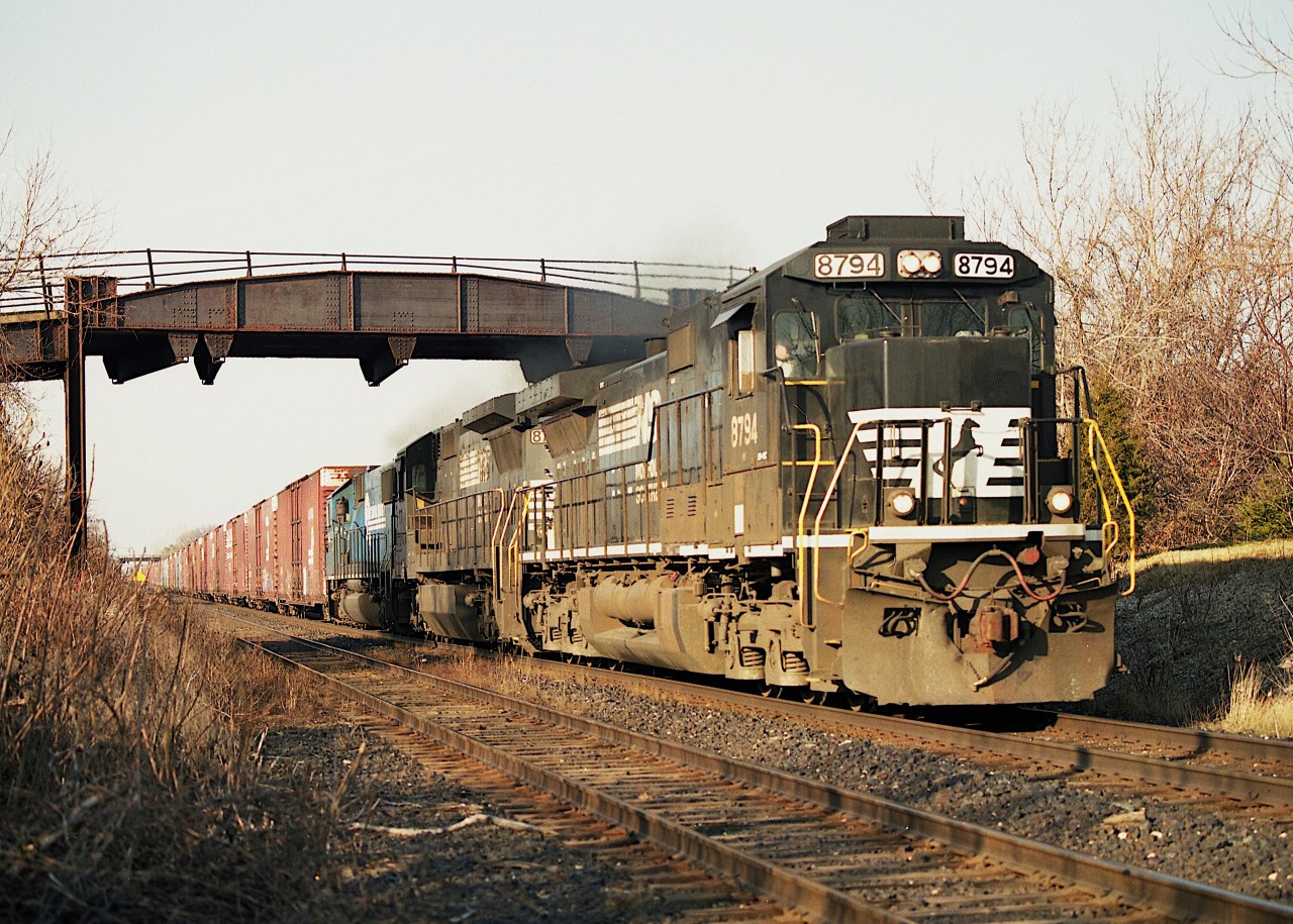 There are some locomotive models that we take for granted, and then all of a sudden, where did they all go? With me it was these behemoth NS Dash 8s, Dash 9s and the like. One day I realized I was not seeing them any more. No wonder. They were all retired.
 In this image, it is an early winter's morning, so early that I found I had to drive east of Grimsby to get enough light for a decent shot. Every minute counts when dealing with early mornings. NS 8794 Dash 9, 8732 Dash 8 and 5418 SD50 x-Conrail provide plenty of horsepower needed to carry #328 eastward to the US border.
 This old bridge is gone as well. Considered unsafe.