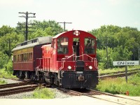 Seen here rolling over the CN Carew diamond, an OSR special family outing train is on the way to their connector with CP. They will stop by the old CP station there in Woodstock. The OSR 1245 will run around the passenger coach and they will head back to Salford.  What a way to spend a nice warm Sunday afternoon. 