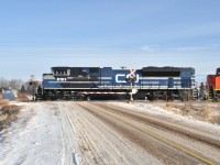  This was a morning I had gone out for whatever, maybe groceries, I dunno; when I saw a headlight down the line as I was crossing the tracks. Anyone who railfans Niagara knows that morning shots of westbounds are next to impossible as you end up shooting right into the sun.
 So I went down a country road and decided I might shoot this if it had anything good. I was really surprised at the leader........one of the four (8100-8103) EMD SD70ACe demonstrators that came to CN in January 2014, so this was shot not long after they arrived. Certainly is a striking paint job.  A number of fans had a lot of luck photographing these before they got painted into standard CN, but I wasn't one of them. This was the best I could do.