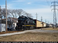 LDSX GP38 #2001 trundles across Campbell Ave in residential West Windsor while on it's way to Ojibway Yard way out on the west end of town.  The 0830 job has lifted about 30 cars from CN interchange at Van De Water yard including several autoracks on the tail end that will be brought back to be loaded near Kildare Road in East Windsor.
