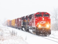 CP 7002 heads towards Smiths Falls and into one of only a few 2024 snowstorms so far.