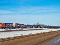 SD40-2(W)s CN 5279 and 5305 make their way south on the Scotford Industrial Spur with a cut of tank cars being transferred from the CPKC Scotford yard to the CN Scotford Yard.