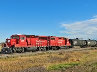 GP20C-ECO, CP 2221 and GP38-2, CP 3041 head north on the CPKC Red Deer Sub with a local cut of tank cars for the Didsbury Terminal.