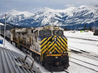 <b>Getting out ahead of the freight</b><br>VIA #1 The Canadian departs Jasper ahead of a sizeable freight led by CN 2786 that has yet to be crewed.<br>Directly behind the Park car at the left of the frame sits tomorrow's Skeena destined to Prince Rupert, BC.<br>At the far right is CN 2100 the conductor training locomotive for Jasper yard employees.<br>The yard won't stay empty for long.