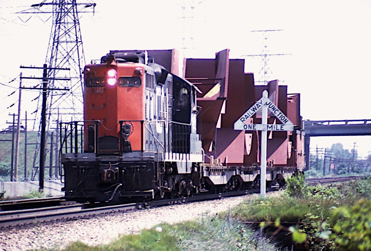 Don't recall what day it was, as notes are lost, but I do remember it being really hot and steamy. But then, it is July. CN 4592 is seen running westbound to Aldershot with some sort of special move. I miss those old wooden "Junction" signs...the one in this case referring to Burlington  and the Halton-Oakville Jct. QEW overpass in background.