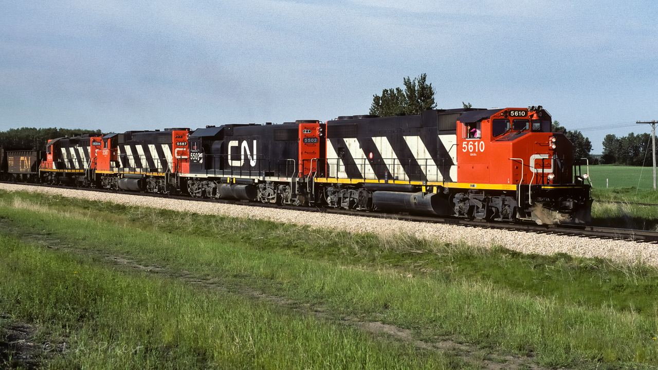 Could not resist this opportunity. My alias at the moment is Extra 5610 west, the 4810 (ex5610) was just posted earlier today, well, here is a 5610 to finish off a threesome. (39 years between the 2 photo's) :^) This string of units had sulphur empties in tow and were at the north end of the connecting track near Egremont. Time 8:00 on a grey/light sun morning.