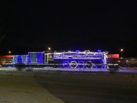 <b>Steam, Stainless, and Stacks</b> <br>
Steam locomotive CN 6015 sits on static display while the stainless steel Budd built passenger cars of VIA Rail's No. 1 The Canadian sit on the station track next to a CN stack train waiting in the background for a fresh crew.<br>
All this and more at 07:44 on a cold and crisp January 24, 2024 morning in Jasper, AB.