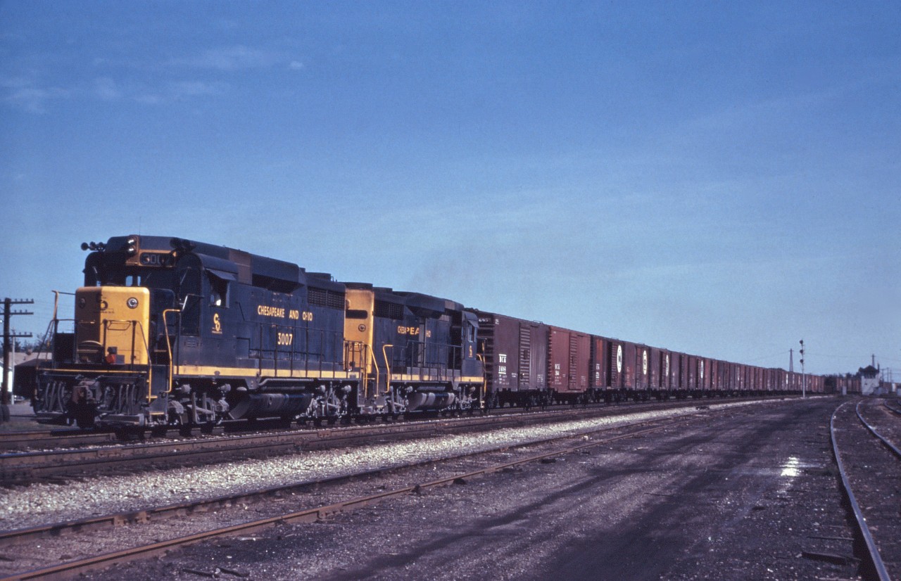 A pair of C&O GP30s lead a westbound freight off NYC's Fort Erie Branch and past WX Tower in this undated shot taken sometime between 1962 (delivery of C&O's GP30s) and January 1973 (opening of the "new" Welland Canal tunnel). This appears to be either C&O 35 or 37 which handled freight from Erie Lackawanna and Buffalo Creek connections at East Buffalo to Detroit, with connections at St. Thomas for Sarnia and Sagninaw, MI as well as at Detroit for Ludington, MI and Chicago. In the 1960s, C&O ran up to five trains in each direction, most going to  Niagara Falls, NY and connecting lines such as the Lehigh Valley.